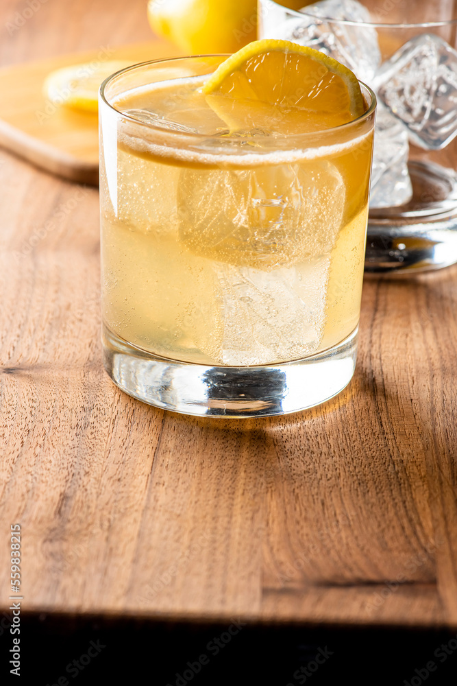 Whiskey sour. Classic Cocktail. Mixed drink with whiskey, lemon juice, sugar, and optionally, a dash of egg white. It is a type of sour, a mixed drink with base spirit, citrus juice, and a sweetener. Whiskey sour. Classic Cocktail. Mixed drink with whiskey, lemon juice, sugar, and optionally, a dash of egg white. It is a type of sour, a mixed drink with base spirit, citrus juice, and a sweetener.