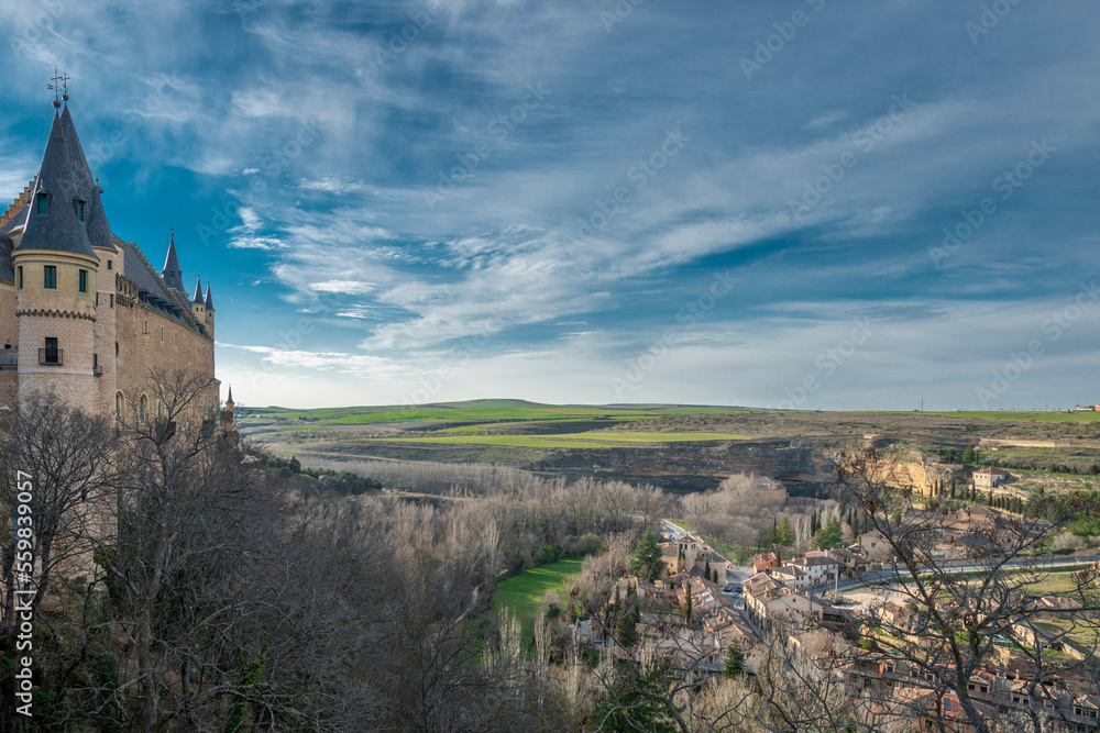 Fototapeta premium Views of the Alcazar of Segovia and the countryside at the end of the town on a winter day