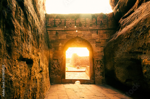 Beautiful sunlight coming out of Badami fort ,gateway to lower Shivalaya temple during sunset.