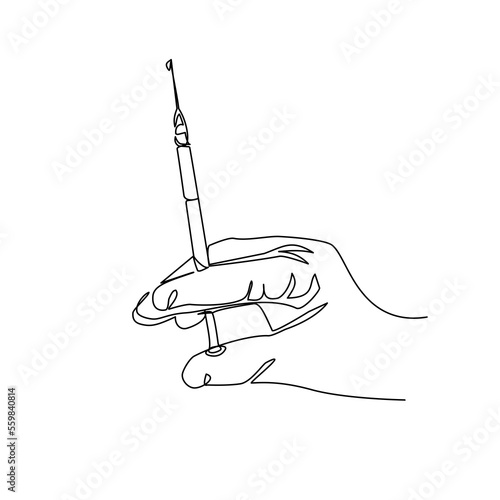hand holding a syringe