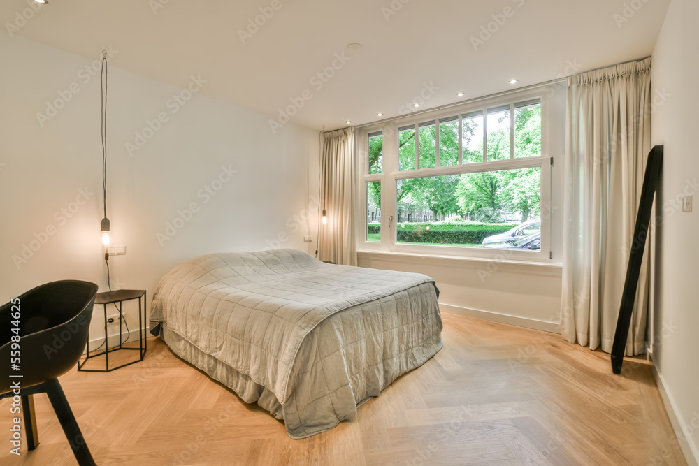 Bedroom interior next to a bright window Bedroom interior next to a bright window