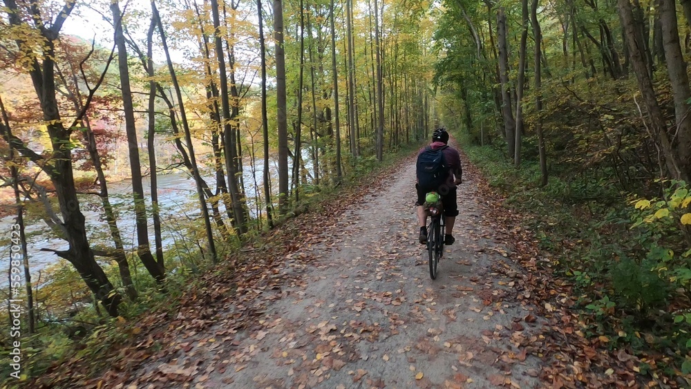 biking solo adventure through the woods by a river biking solo adventure through the woods by a river