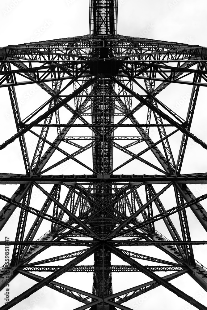 Steel construction of the very high historical railway Bridge “Müngstener Brücke“ between Solingen and Remscheid Germany from below the railroad track. Symmetrical view  contrasting black and white.