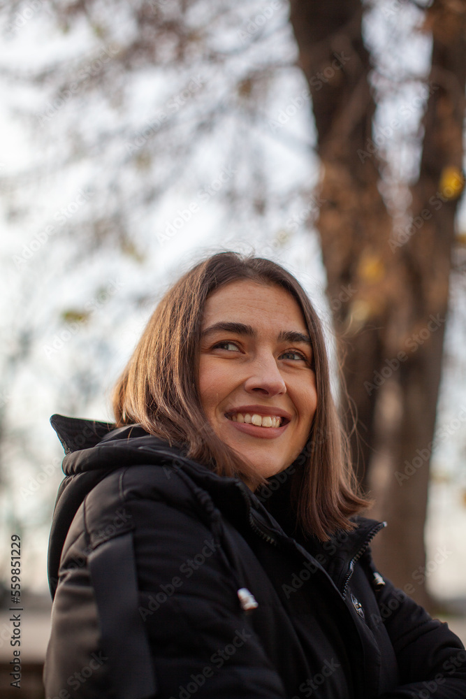 smiling woman enjoying autumn outdoors smiling woman enjoying autumn outdoors