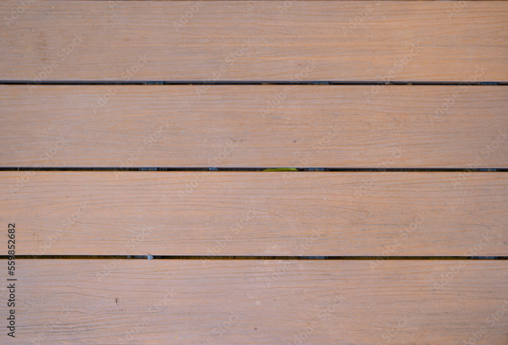 Fototapeta premium Natural wood slats wall or lath line arrange. Flooring pattern surface texture. Close-up of interior architecture material for design decoration background.
