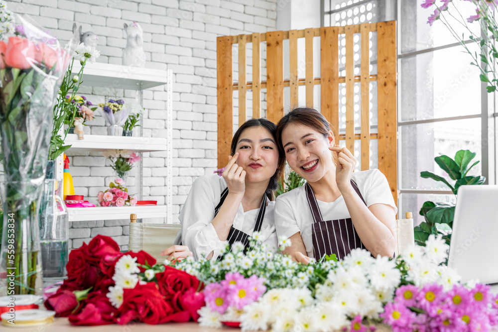 group of female florists Asians are arranging flowers for customers who come to order them for various ceremonies such as weddings, Valentine's Day or to give to loved ones. group of female florists Asians are arranging flowers for customers who come to order them for various ceremonies such as weddings, Valentine's Day or to give to loved ones.