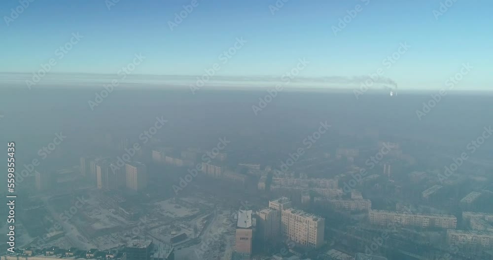 Aerial view of polluted city covered with smog Aerial view of polluted city covered with smog