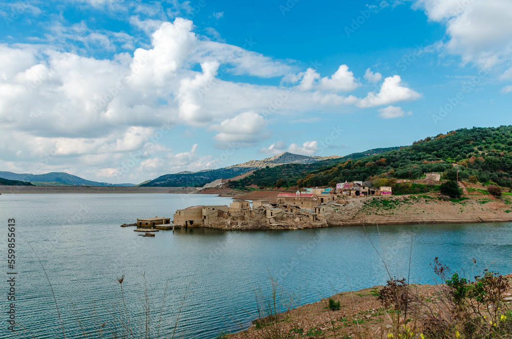 The artificial dam of Aposelemi and the abandoned sunken village of Sfendili which is sinking in an effort, the local authorities to face the drought.