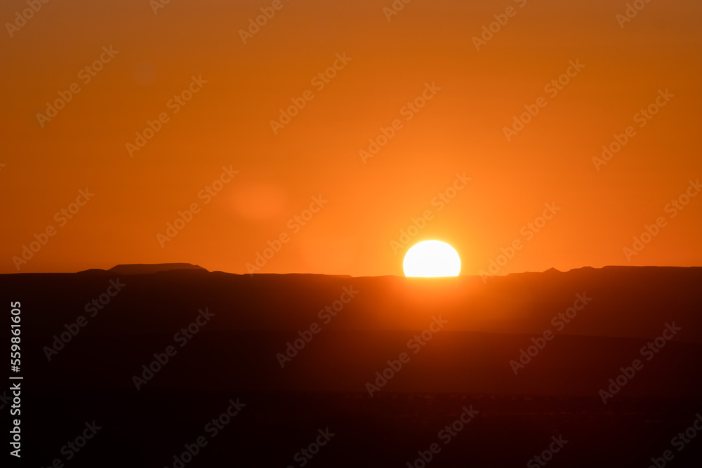 stunning cloudless colorful sunset above mountains in Namibia