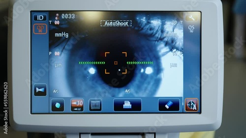 Optometrist examining patient's eyes in eye surgery clinic. Eyesight check.