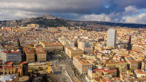 Aerial view of Vomero hill and Castel Sant' Elmo from the historic center of Naples, Italy. In foreground there is Piazza Municipio, a large square of the city. 