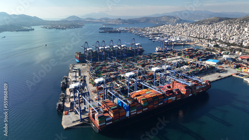 Aerial drone photo of industrial container logistics unloading import and export container terminal of Perama - Piraeus, Attica, Greece