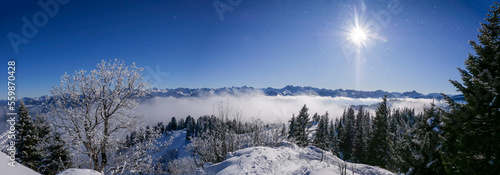 Allgäuer Berge in der Sonne und Nebel im Tal mit Wannenkopf im Vordergrund photo