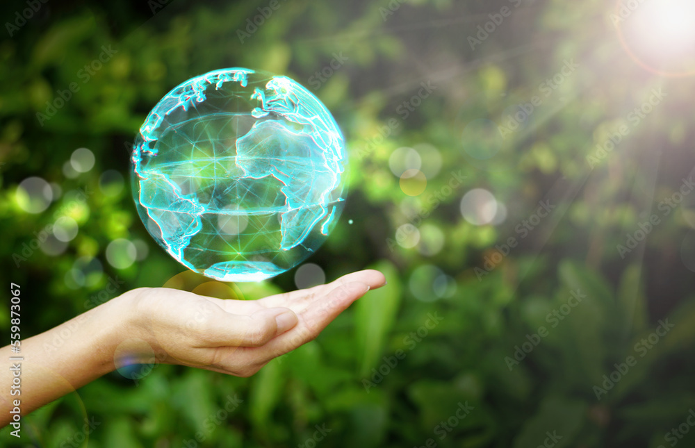 Hand holding a globe graphic on nature background, Renewable energy-based green businesses can limit climate change and global warming, environment, earth day, Hand holding a globe graphic on nature background, Renewable energy-based green businesses can limit climate change and global warming, environment, earth day,