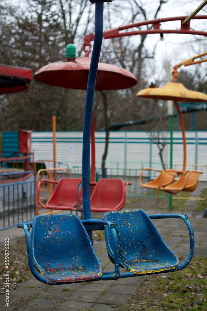 Carousel seats in an abandoned amusement park