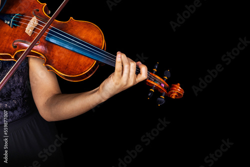 Violin player. Violinist playing violin hands bow.