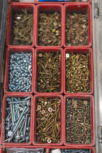 many different screws in the  organizer of master for work © Tsyb Oleh