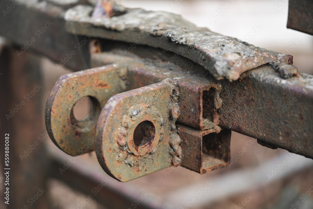 old rusty metal spare parts for work in agriculture