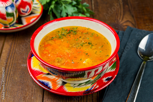 mastava Uzbek cuisine on old wooden table photo