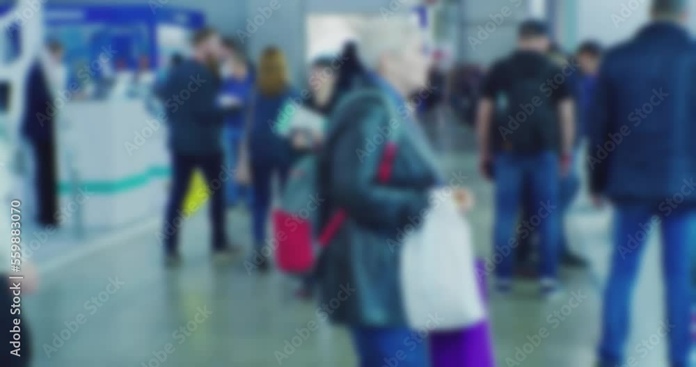 blurred silhouettes of unrecognizable people inside a large modern building.slow motion video. blurred silhouettes of unrecognizable people inside a large modern building.slow motion video.