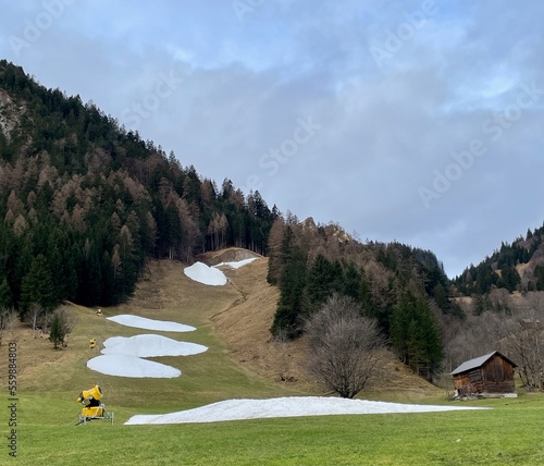 No snow on skiing slopes in winter due to climate change.