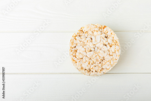 Stack of crispy rice cakes on white texture wood. Diet bread. Diet. proper nutrition. GLUTEN FREE. Copy space. Place for text.