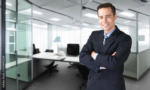 Young smart business person posing in office