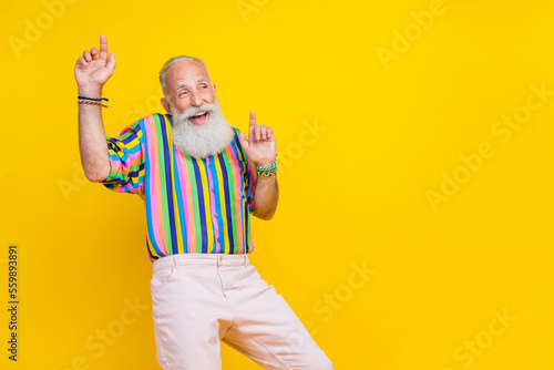 Tela Photo of funky good mood man wear colorful shirt rising having fun pointing fing