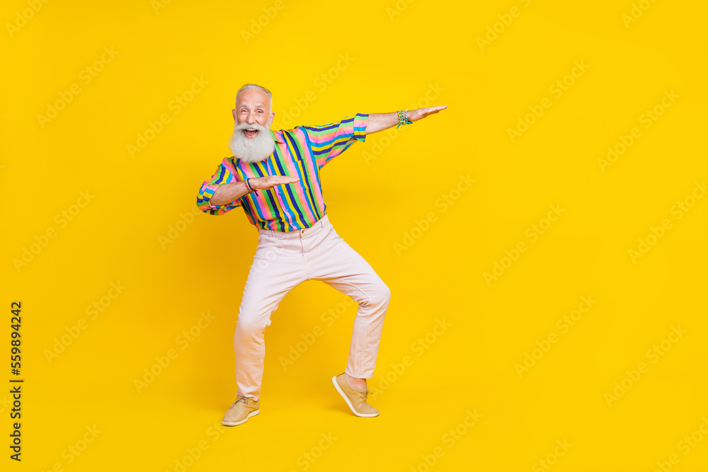 Full length photo of charming sweet man wear colorful shirt dancing discotheque having fun empty space isolated yellow color background