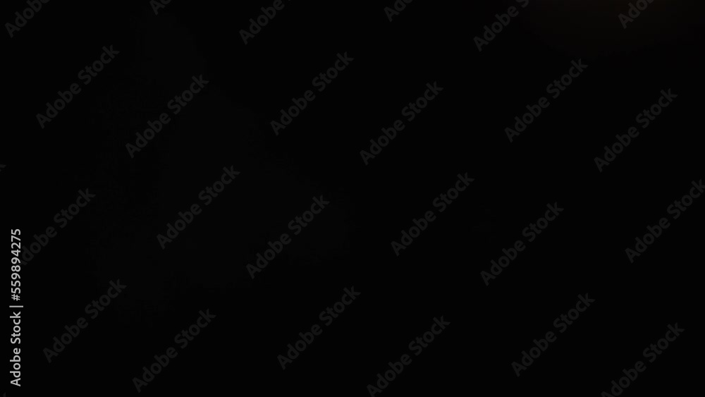Light permeates the frames on a black background. Studio lens flare. Natural lighting lamp rays Bokeh effect. For composing footage, video styling, transitions. White light. Light permeates the frames on a black background. Studio lens flare. Natural lighting lamp rays Bokeh effect. For composing footage, video styling, transitions. White light.