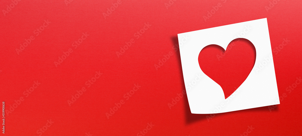 Heart shaped on note paper with panoramic red background Heart shaped on note paper with panoramic red background