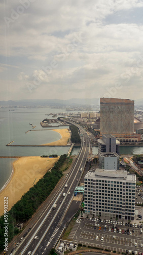 Where the sea meets the city, ocean meets city, highway at the ocean, highway at the sea, road at the sea, road at the ocean, empty beach