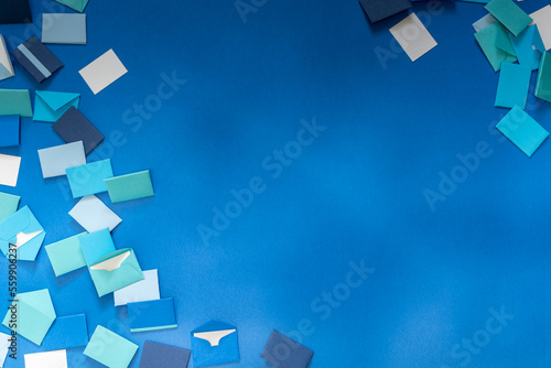 Background of colorful correspondence envelopes in shades of blue and white.  Copy space. 