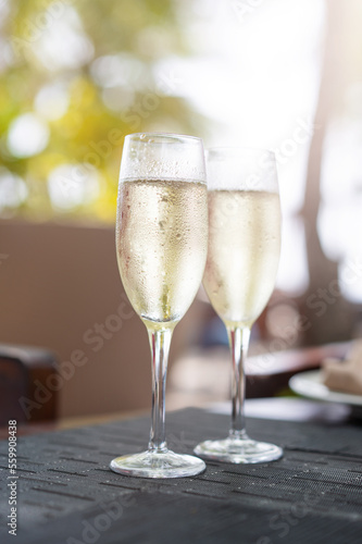Two glasses of champagne in a restaurant on the coast of a resort in the Maldives