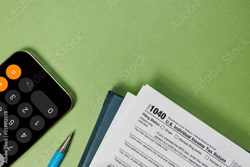 Fotografie US individual tax form, pencil, smart phone glasses, top view