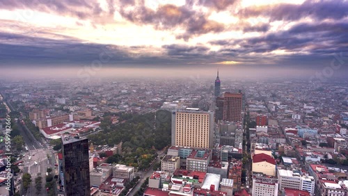 Downtown Mexico City at sunrise timelapse, can be appreciated Bellas Artes palace,  Latin American Tower and the Alameda. photo