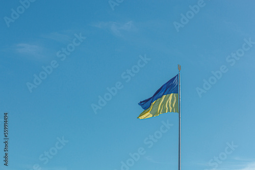 Ukrainian flag against the blue sky © Minakryn Ruslan 