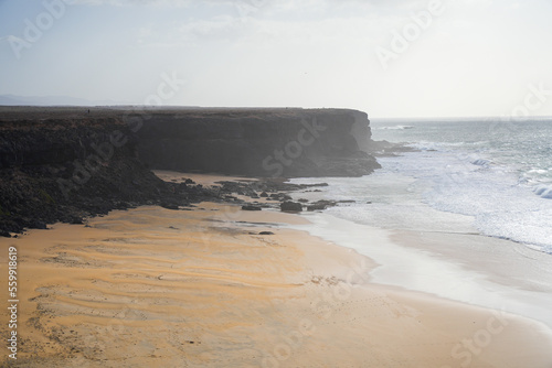 Cliffs over Piedra playa ("Stone beach") near the village of El Cotillo in the north of Fuerteventura in the Canary Islands, Spain