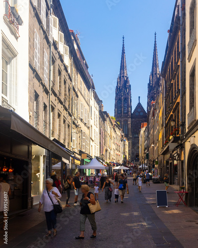 Streets of Clermont-Farrand in afternoon. View of Cathedral of Our Lady of the Assumption in background. photo