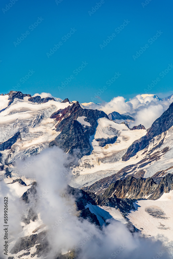 Fototapeta premium Switzerland 2022, Beautiful view of the Alps and Blue Sky around Titlis mountain.