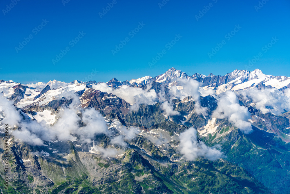 Fototapeta premium Switzerland 2022, Beautiful view of the Alps and Blue Sky around Titlis mountain.