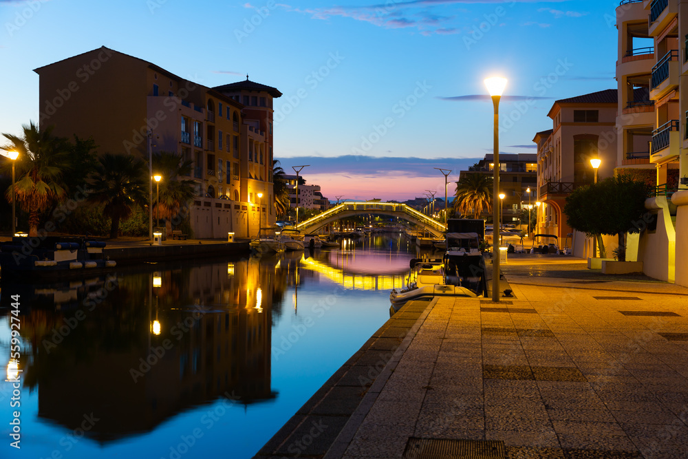 Fototapeta premium Photo of French city Frejus in evening with view of Reyran River and residential buildings.