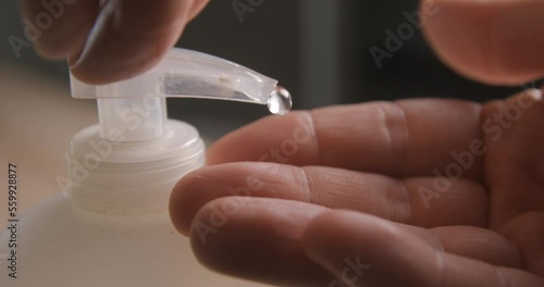 Liquid soap pumping on hands slow motion 4K