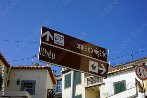 Direction signs to Ilhéu and beach praia do vigário in Câmara de Lobos, Madeira, Portugal