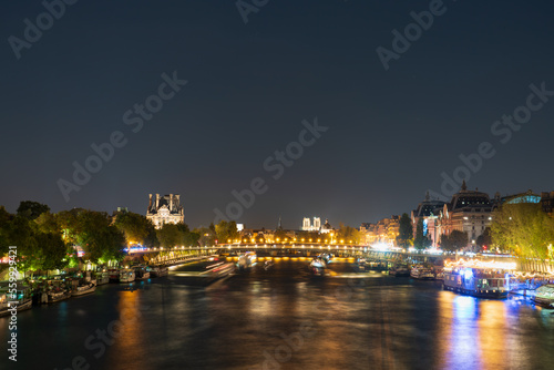 Night time view Paris with Seine river canal © Pawel Pajor