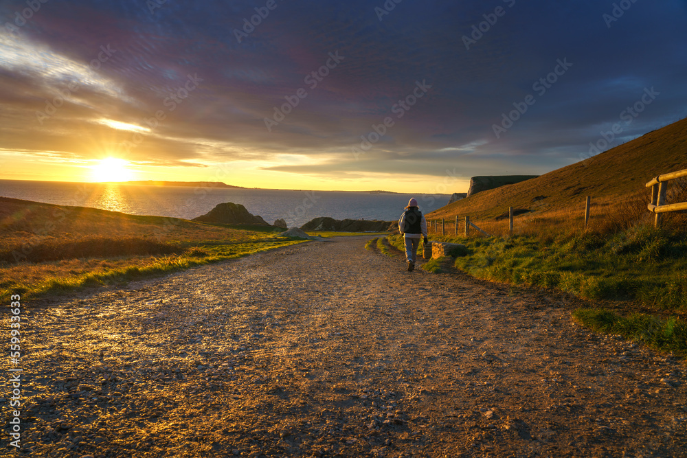 Durdle door walk path at sunset in Dorset. England