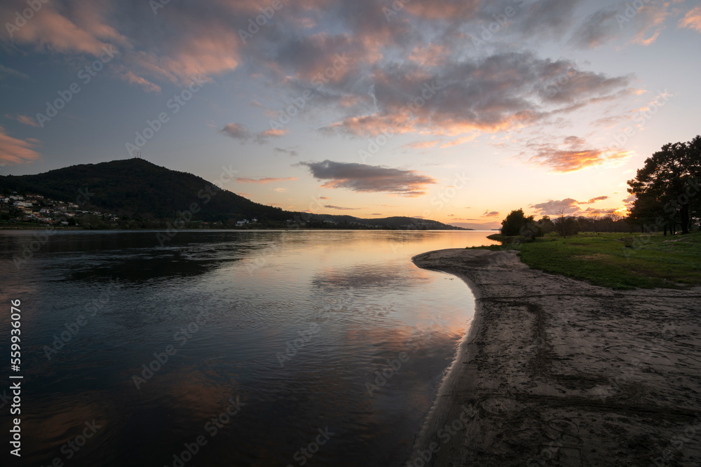 Fototapeta premium View of the miño river and the Eiras river beach at sunset in O Rosal