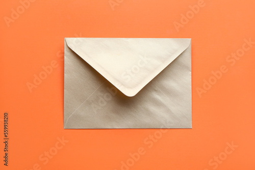 Golden envelope on color background