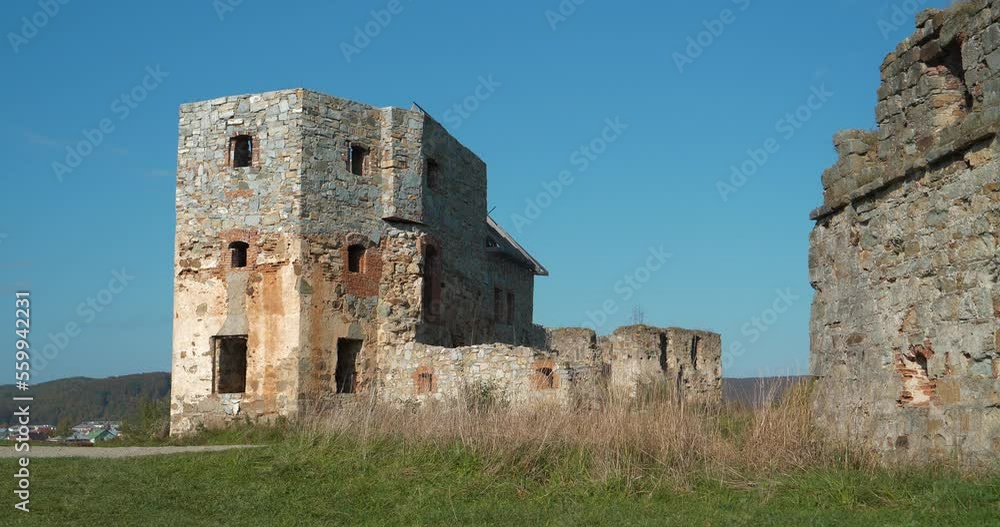 Ancient stone tower, turret in Pniv Castle - medieval historical object in Ivano-Frankivsk region of western Ukraine. Cinema 4K 60fps video Ancient stone tower, turret in Pniv Castle - medieval historical object in Ivano-Frankivsk region of western Ukraine. Cinema 4K 60fps video