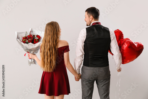 Romantic couple holding han...